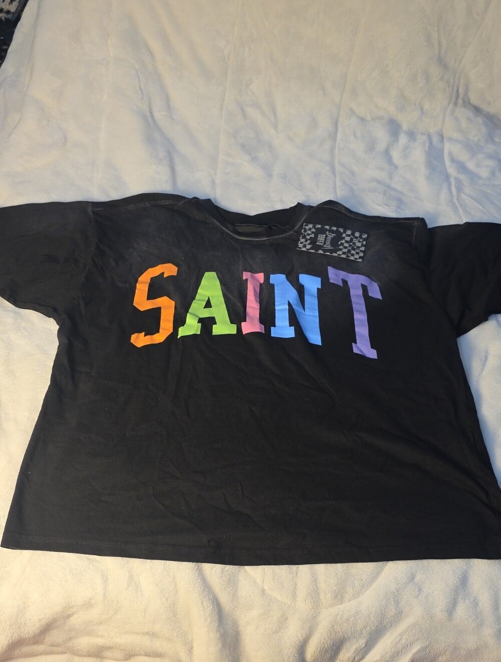 Rebel Vengeance Black Tee with Multicolor SAINT Block Letters
